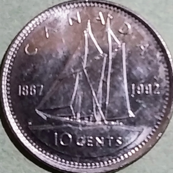 CAD0.1【カナダ】10セント エリザベス2世 自治領カナダ125年記念 (1992)